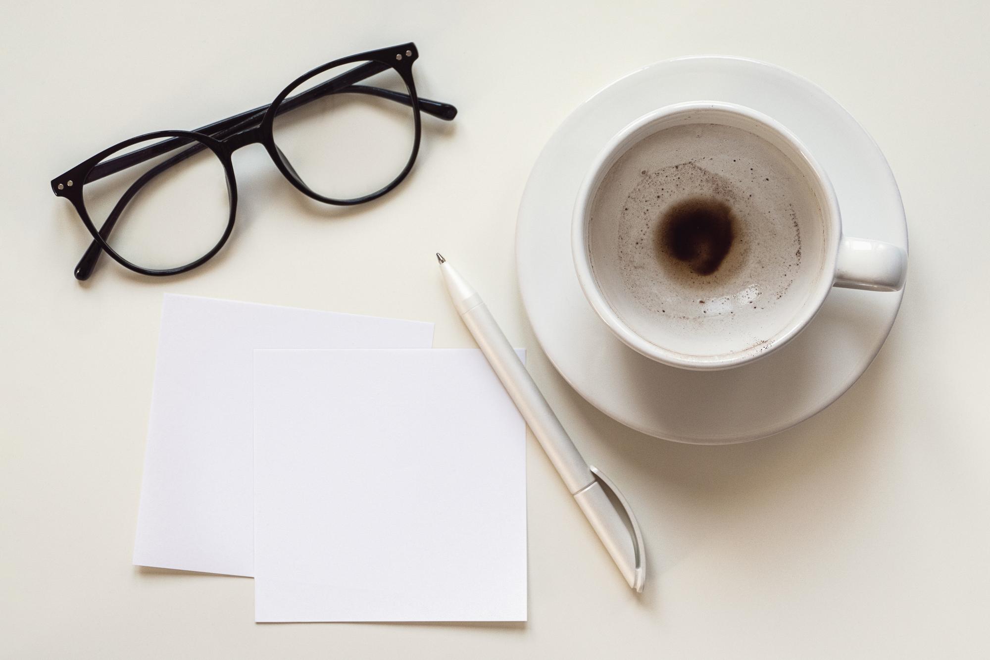 Interview notes and coffee on desk